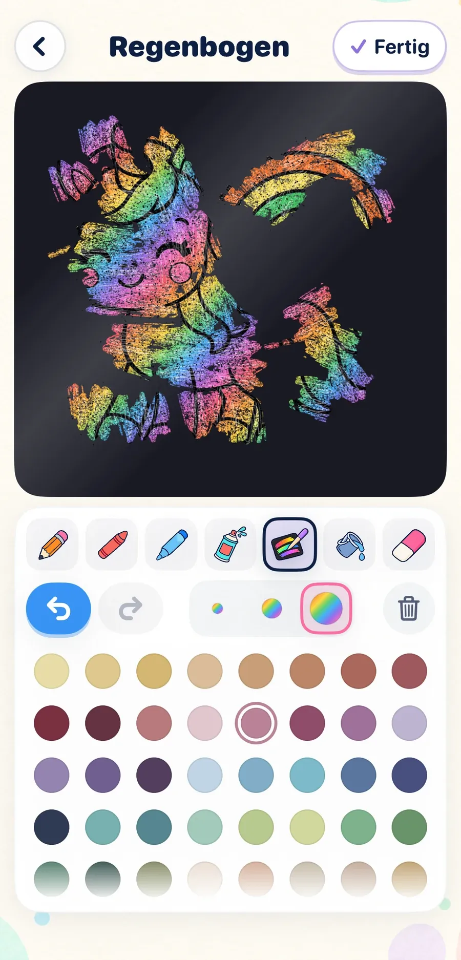 Ein Kratzbild mit einem Einhorn, das in Regenbogenfarben freigekratzt ist